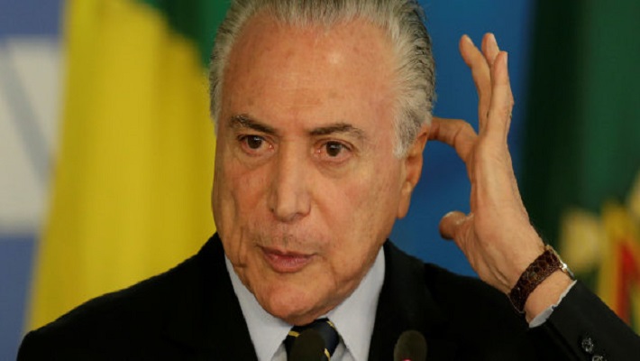 Brazil’s President Michel Temer gestures during a ceremony to launch the Digital Platform of the Emprega Brasil Program, at the Planalto Palace in Brasilia