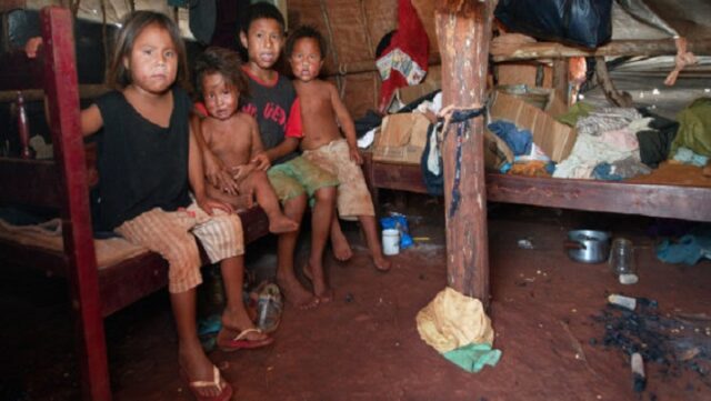 Brazilian Indians children inside their house.